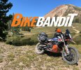 BikeBandit's logo in front of mountains and a KTM motorcycle. Photo courtesy of BikeBandit's Facebook page. 